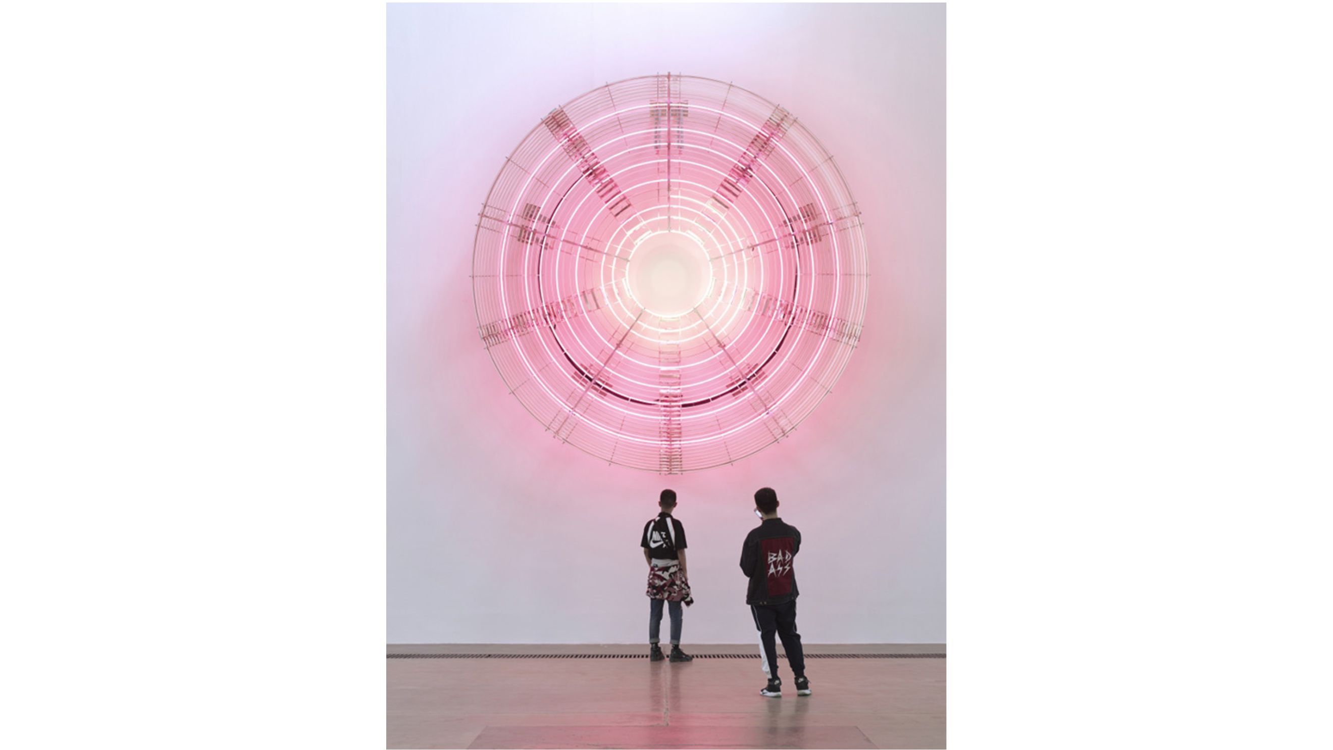 Carsten Höller 'Decimal Clock (White and Pink)' 2018, neon light, aluminum structure, 100 x 446 ø cm. Photo: Jonathan Leijonhufvud - Credits: Courtesy Press Office