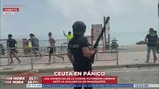 Los comerciantes cierran sus negocios y comienzan las cargas policiales en Ceuta