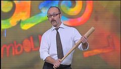 Il signor Verduci con la sua mazza da baseball a Zelig 2012