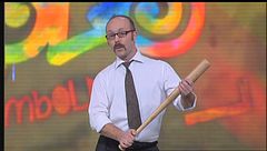Il signor Verduci con la sua mazza da baseball a Zelig 2012