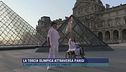 La torcia olimpica attraversa Parigi