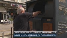 Vestiti lasciati fuori dal cassonetto, pensionata multata