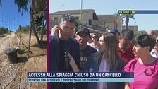 Accesso alla spiaggia chiuso da un cancello