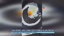 Caldo record, uova e carne cotte in padella su una finestra